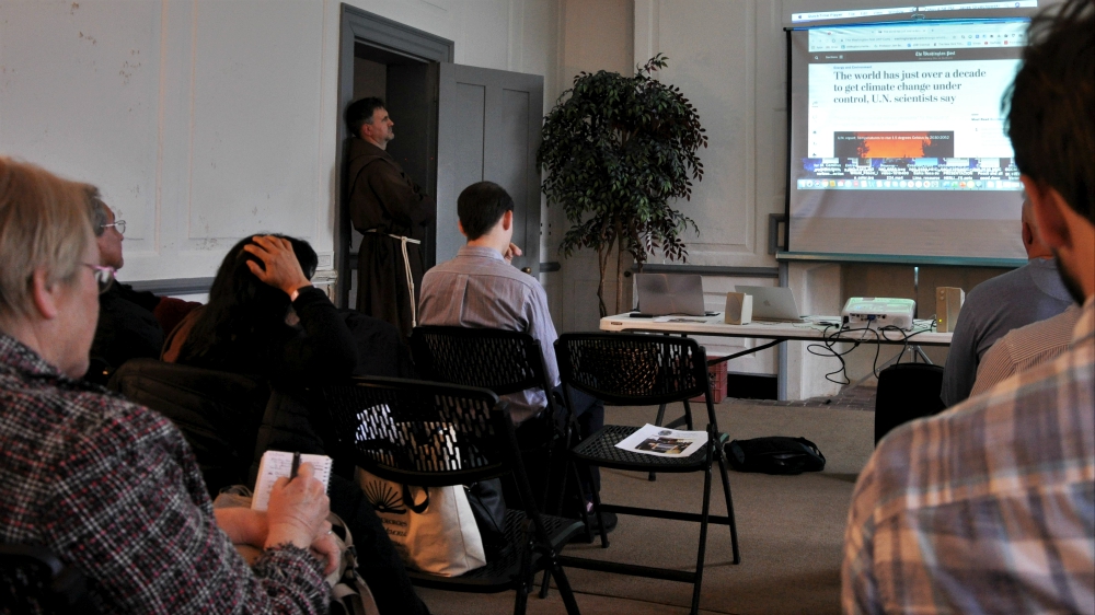 As part of their teach-in, Maryland Catholics watch a short video on the urgency of addressing climate change. (NCR photo/Jesse Remedios) As part of their teach-in, Maryland Catholics watch a short video on the urgency of addressing climate change. (NCR photo/Jesse Remedios)