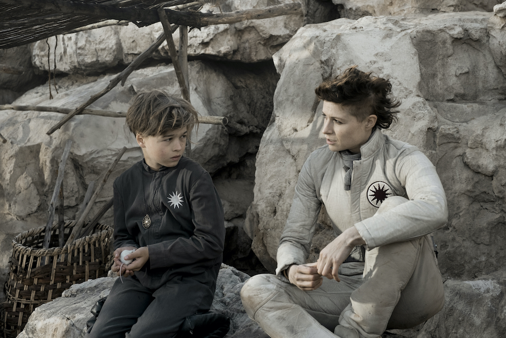 Scene from Season 1, Episode 8 of "Raised by Wolves," with Felix Jamieson, left, and Niamh Algar on HBO Max (Warner Media/Coco Van Oppens) Scene from Season 1, Episode 8 of "Raised by Wolves," with Felix Jamieson, left, and Niamh Algar on HBO Max (Warner Media/Coco Van Oppens)
