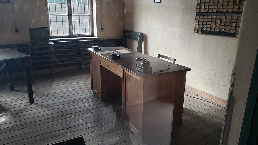 One of the displays at the Auschwitz concentration camp shows the desk of a commander who would execute the sentences imposed by the Gestapo court. (NCR photo/Chris Herlinger)