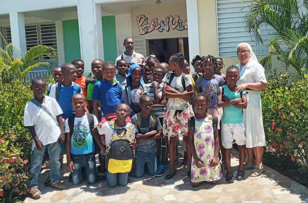 Sr. Gloria Inés Gonzales Ramírez, right, a Dominican Sister of the Presentation of the Blessed Virgin, seeks to change Haiti's educational paradigm as director of a local school and nursery in the semirural commune of Corail.