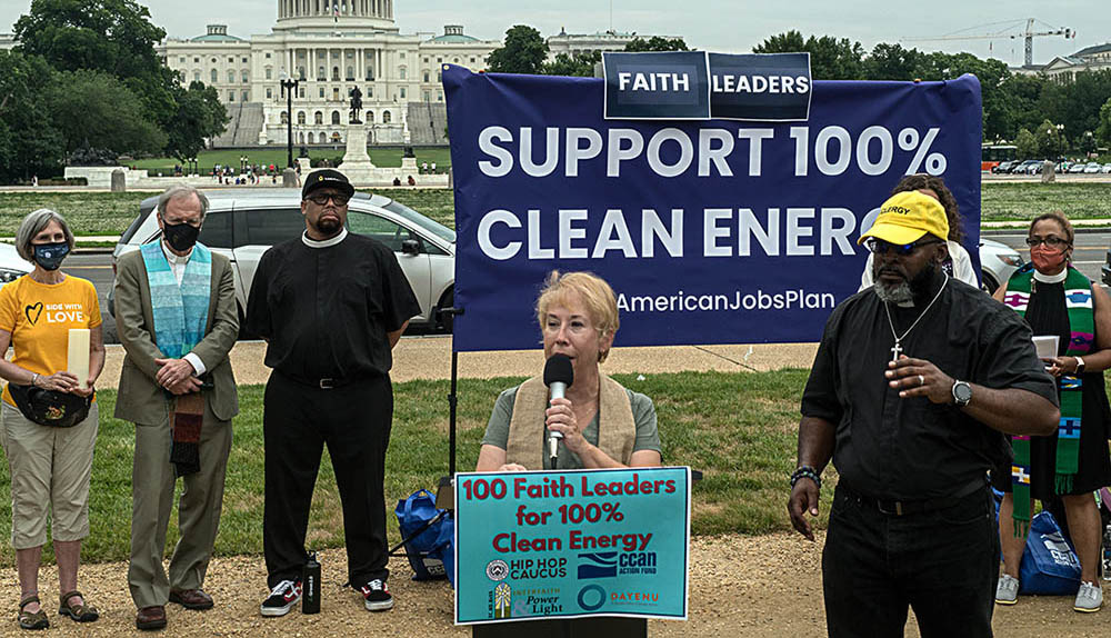 The Rev. Susan Hendershot, president of Interfaith Power & Light, and the Rev. Michael Malcom of Alabama Interfaith Power & Light, speak during the "100 Leaders for 100% Clean Energy" rally on June 9. (Courtesy of Interfaith Power & Light)