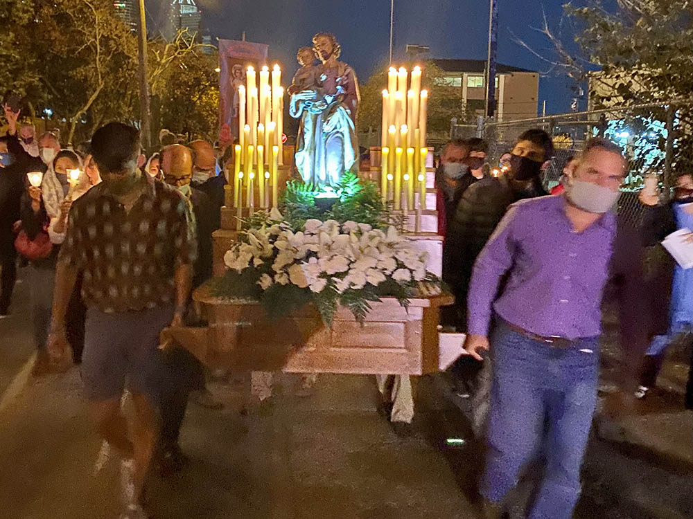 Several men carry a large statue of St. Joseph during the 2021 St. Joseph's Day procession hosted by St. Joseph Catholic Church in Houston. (Courtesy of Virginia Fraguio)