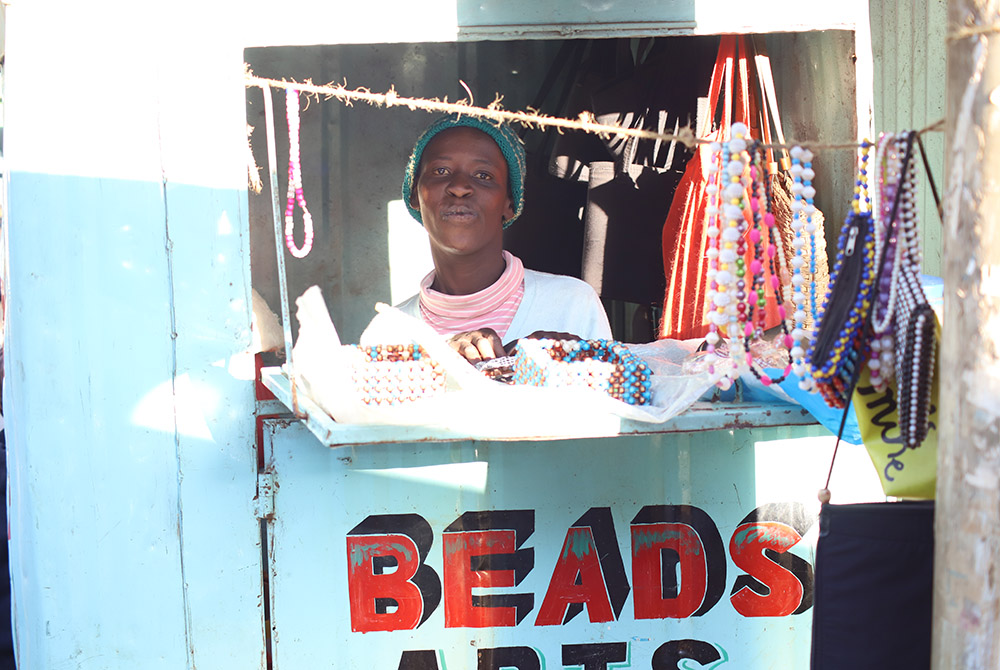 Mary Wanjiku, 26, is pictured inside her beadwork shop along a busy junction in Limuru, a town in central Kenya. (Wycliff Oundo)