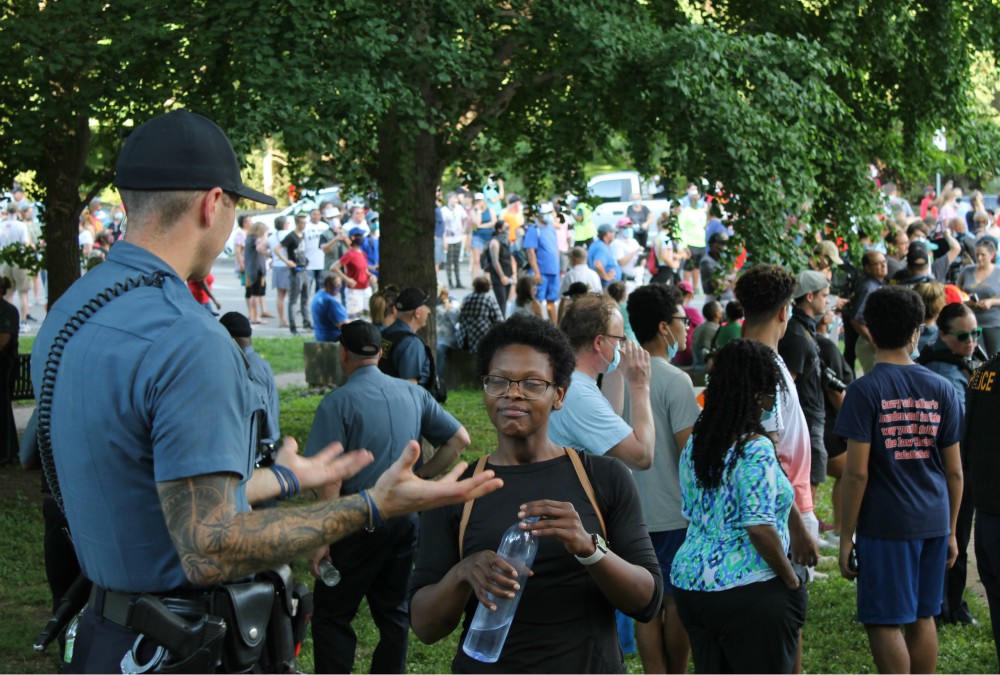 Justine Kenner speaks with a police officer ahead of a "Unity March" in Kansas City, Missouri, June 3. (NCR photo/Brian Roewe) Justine Kenner speaks with a police officer ahead of a "Unity March" in Kansas City, Missouri, June 3. (NCR photo/Brian Roewe)