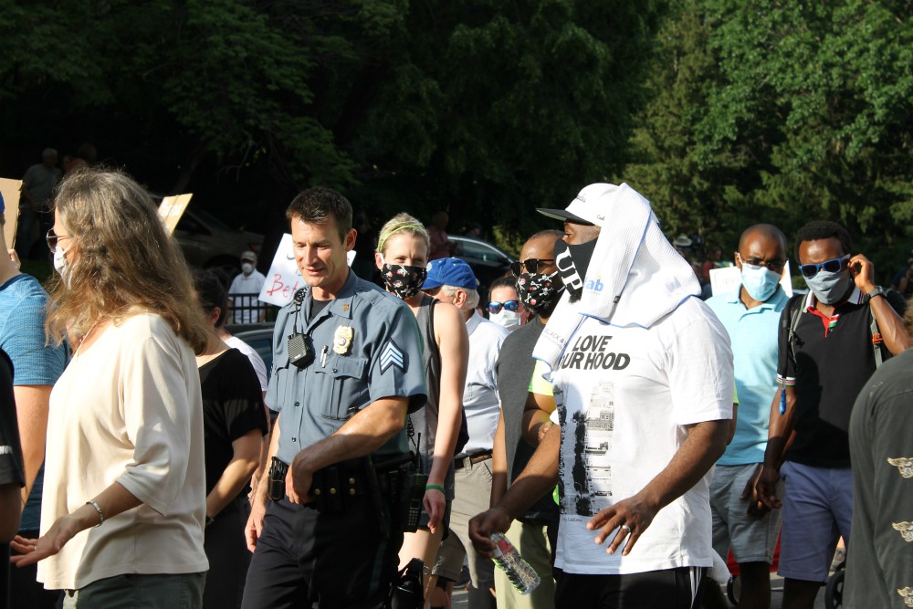 A Kansas City, Missouri, police officer walks with protesters during a "Unity March" June 3 in response to the death of George Floyd in Minneapolis. (NCR photo/Brian Roewe) A Kansas City, Missouri, police officer walks with protesters during a "Unity March" June 3 in response to the death of George Floyd in Minneapolis. (NCR photo/Brian Roewe)