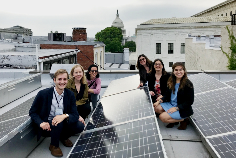 Members of Interfaith Power & Light pose near the solar panels on the roof of the Lutheran Church of the Reformation in Washington, D.C. (Interfaith Power & Light)