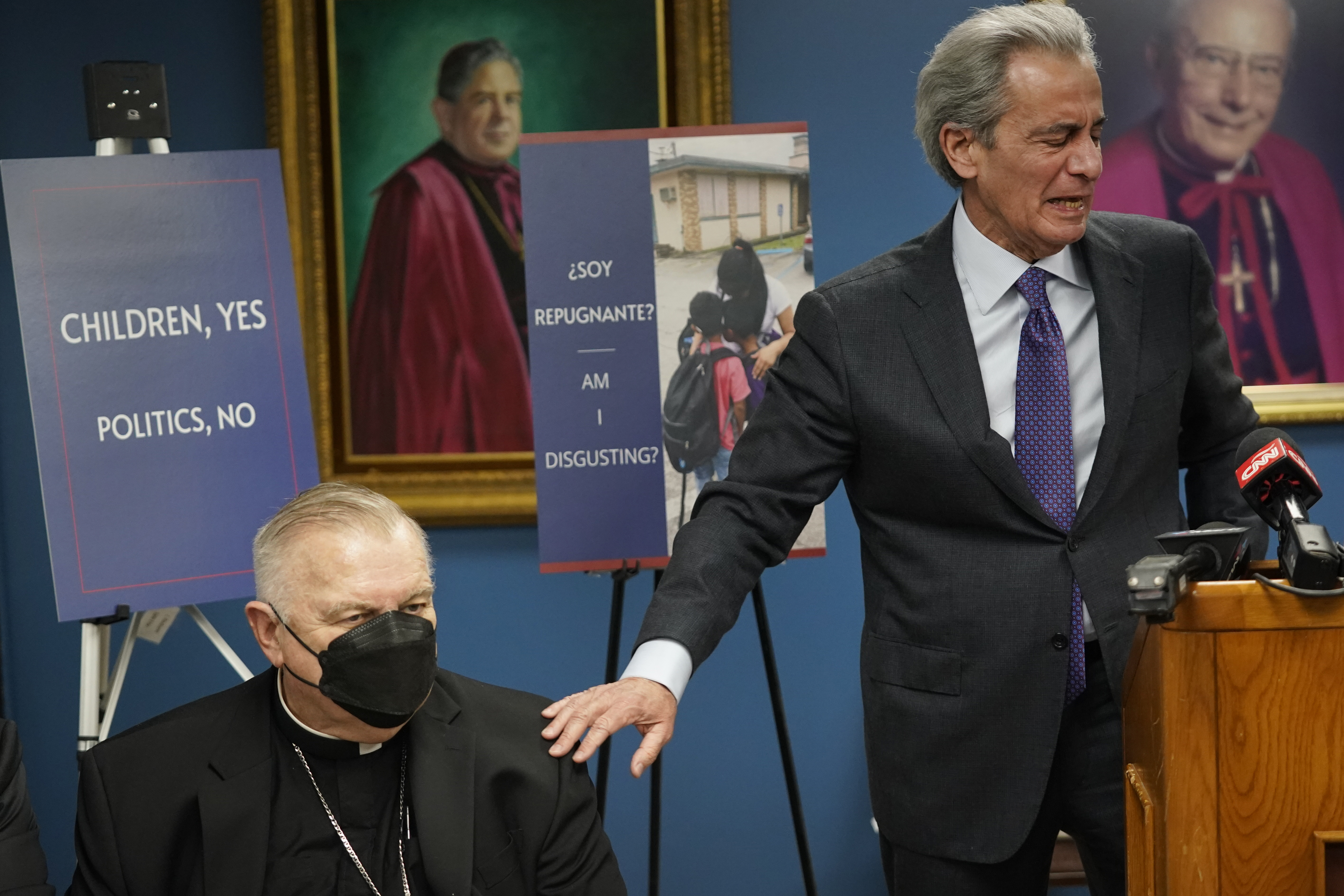 Tony Argiz, right, puts his hand on Archbishop of Miami Thomas Wenski 's shoulder as he speaks during a news conference, at the Archdiocese of Miami Pastoral Center in Miami Shores, Fla., Feb. 10, 2022, (AP Photo/Wilfredo Lee) Tony Argiz, right, puts his hand on Archbishop of Miami Thomas Wenski 's shoulder as he speaks during a news conference, at the Archdiocese of Miami Pastoral Center in Miami Shores, Fla., Feb. 10, 2022, (AP Photo/Wilfredo Lee)