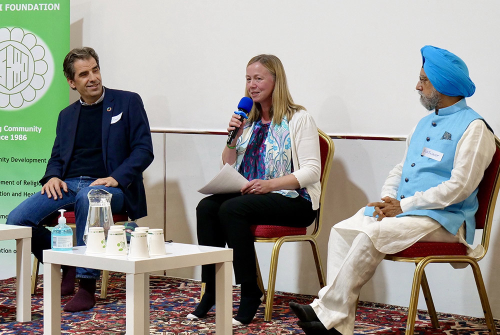 Lorna Gold, center, project lead of the FaithInvest Faith Plans program, speaks about the initiative at an event Nov. 7 in Glasgow, Scotland, during the COP26 U.N. climate change conference. (Courtesy of FaithInvest)