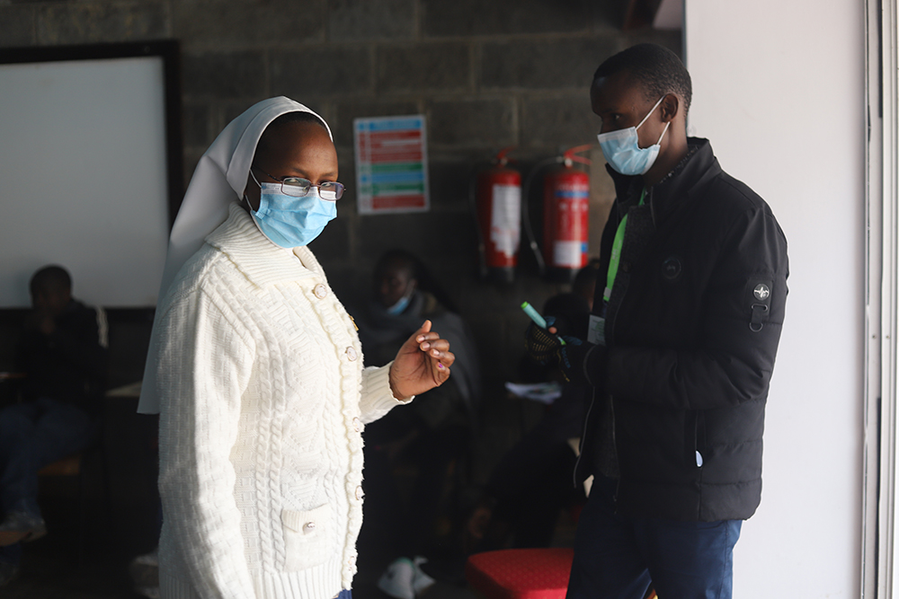 A religious sister displays her inked finger after casting her ballot Aug. 9 inside a polling station at the Milimani Primary School in Nairobi, Kenya. Voters in Kenya woke up early to vote to choose their next president between Raila Odinga, supported by