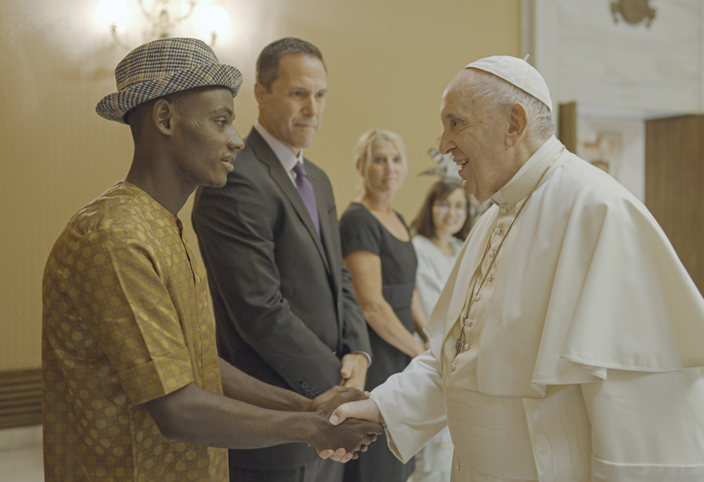 Pope Francis meets with Arouna Kandé, a climate refugee from Senegal, in a scene from "The Letter: A Message for Our Earth," a new documentary based upon the pope's 2015 ecology encyclical "Laudato Si', on Care for Our Common Home." (Laudato Si' Movement)