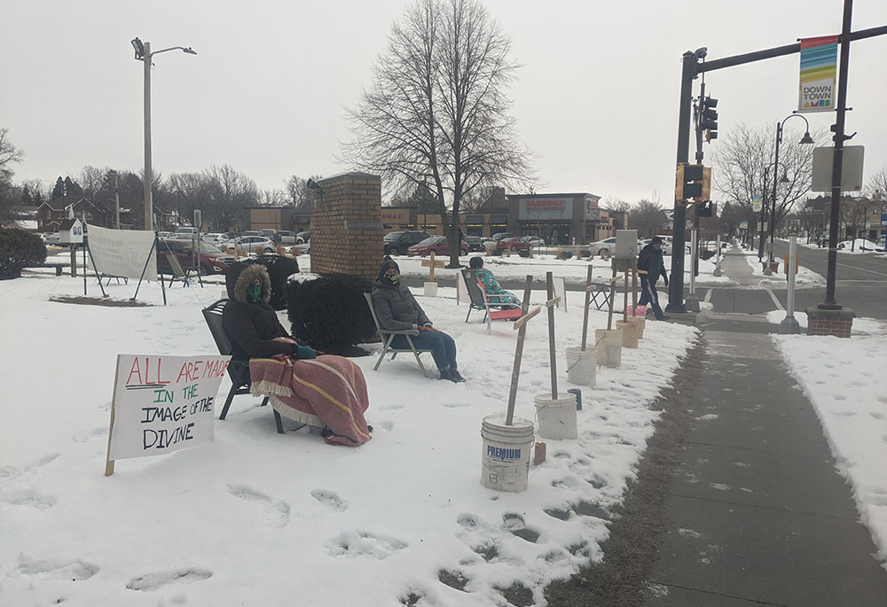 Members of the Romero House community hosted a witness against the death penalty in January 2021 on an intersection in Ames, Iowa. (Courtesy of Matt Mitchell)