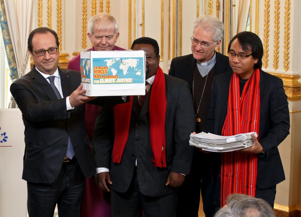 France's President Francois Hollande, bishop of Salisbury Nicholas Holtam, Cameroon's Augustine Njamnshi, Bishop of Brazil Leonardo Steiner and other. (AP/Michel Euler)