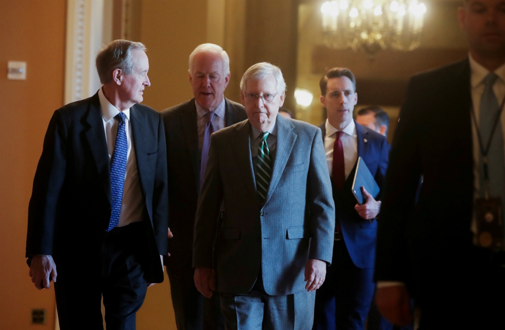 Senate Majority Leader Mitch McConnell, R-Kentucky, center, is seen with fellow Republican senators Jan. 16 at the U.S. Capitol in Washington. (CNS/Reuters/Jonathan Ernst) Senate Majority Leader Mitch McConnell, R-Kentucky, center, is seen with fellow Republican senators Jan. 16 at the U.S. Capitol in Washington. (CNS/Reuters/Jonathan Ernst)