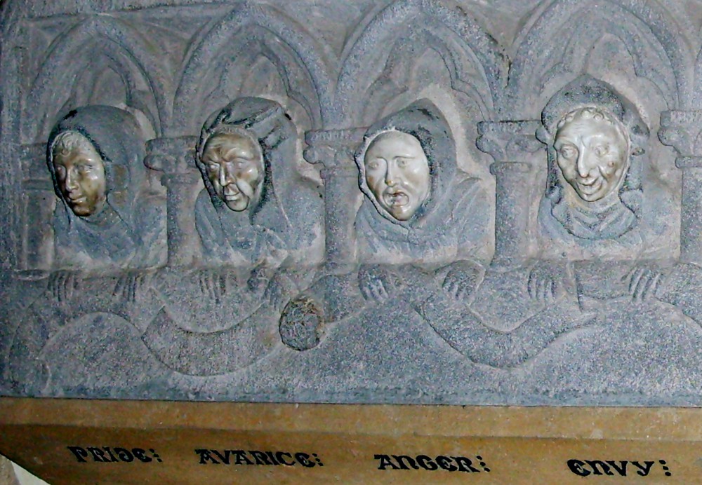 The faces of monks illustrate deadly sins in this detail from a circa 1300 sculpture. (Wikimedia Commons/Simon Burchell)