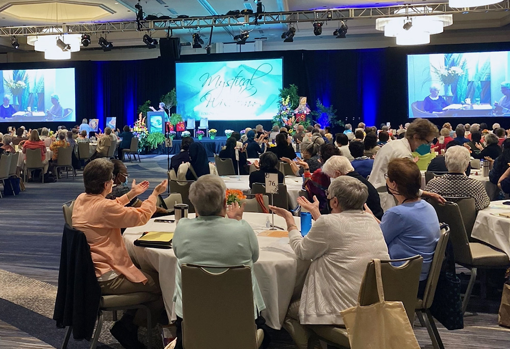 Attendees pray with theologians Baltimore Carmelite Sr. Connie FitzGerald and M. Shawn Copeland Aug. 10 at the Leadership Conference of Women Religious Assembly in St. Louis. (GSR photo/Sr. Helga Leija)