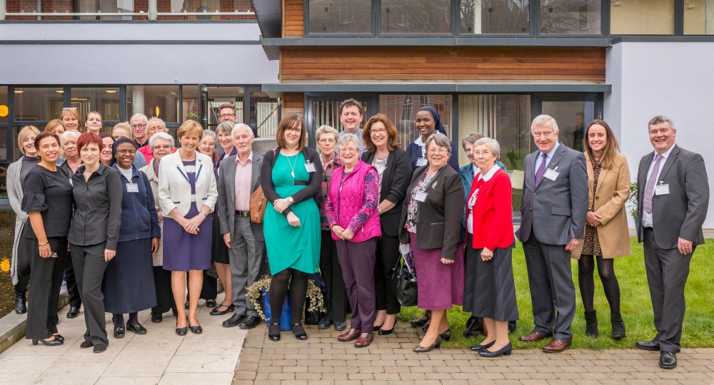 Sr. Jean Quinn (front row, fourth from left) and members of the team of Sophia Housing in 2017 (Provided photo)