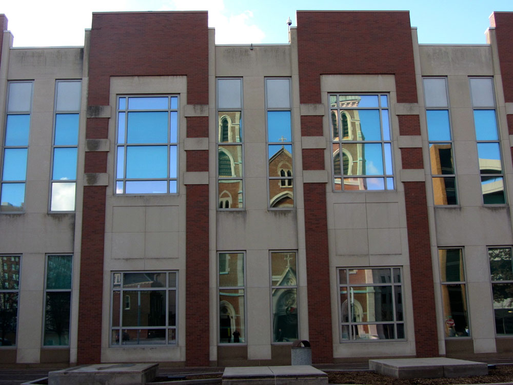 St. John the Evangelist Catholic Church is reflected on windows of the Indiana Convention Center in downtown Indianapolis. (Flickr/Richie Diesterheft)