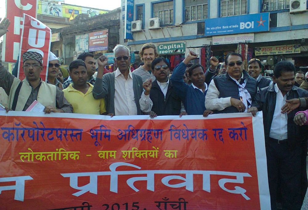 Jesuit Fr. Stan Swamy participates in a protest against corporate land acquisition. (Dan Solomon)