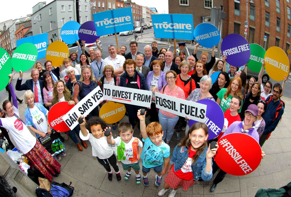 People celebrate July 12, 2018, after the passage of the Fossil Fuel Divestment Bill in Ireland. (Mark Stedman)