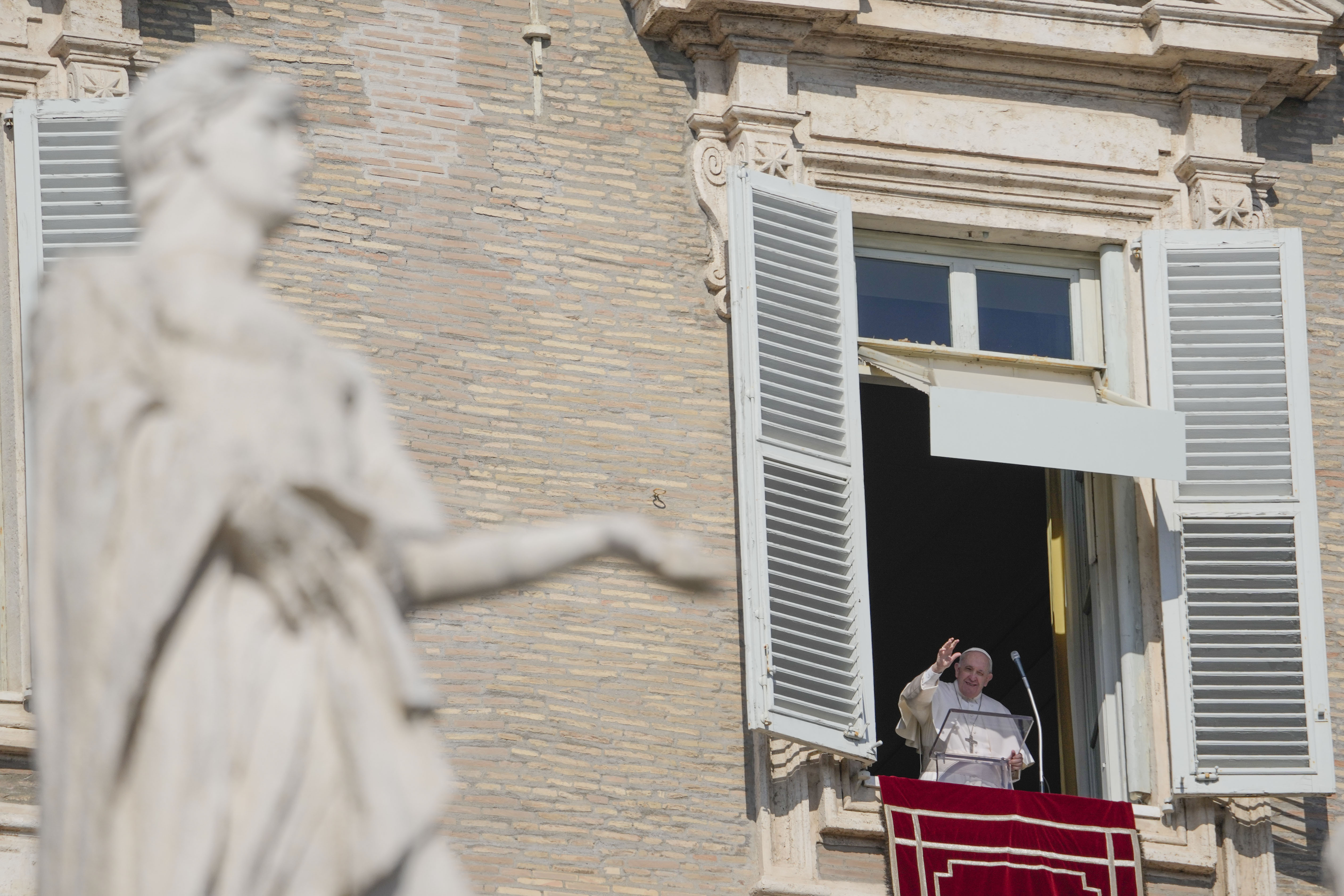 Pope Francis delivers the Angelus noon prayer from his studio window overlooking St. Peter's Square at the Vatican, Sunday, Feb. 6, 2022. (AP Photo/Gregorio Borgia)