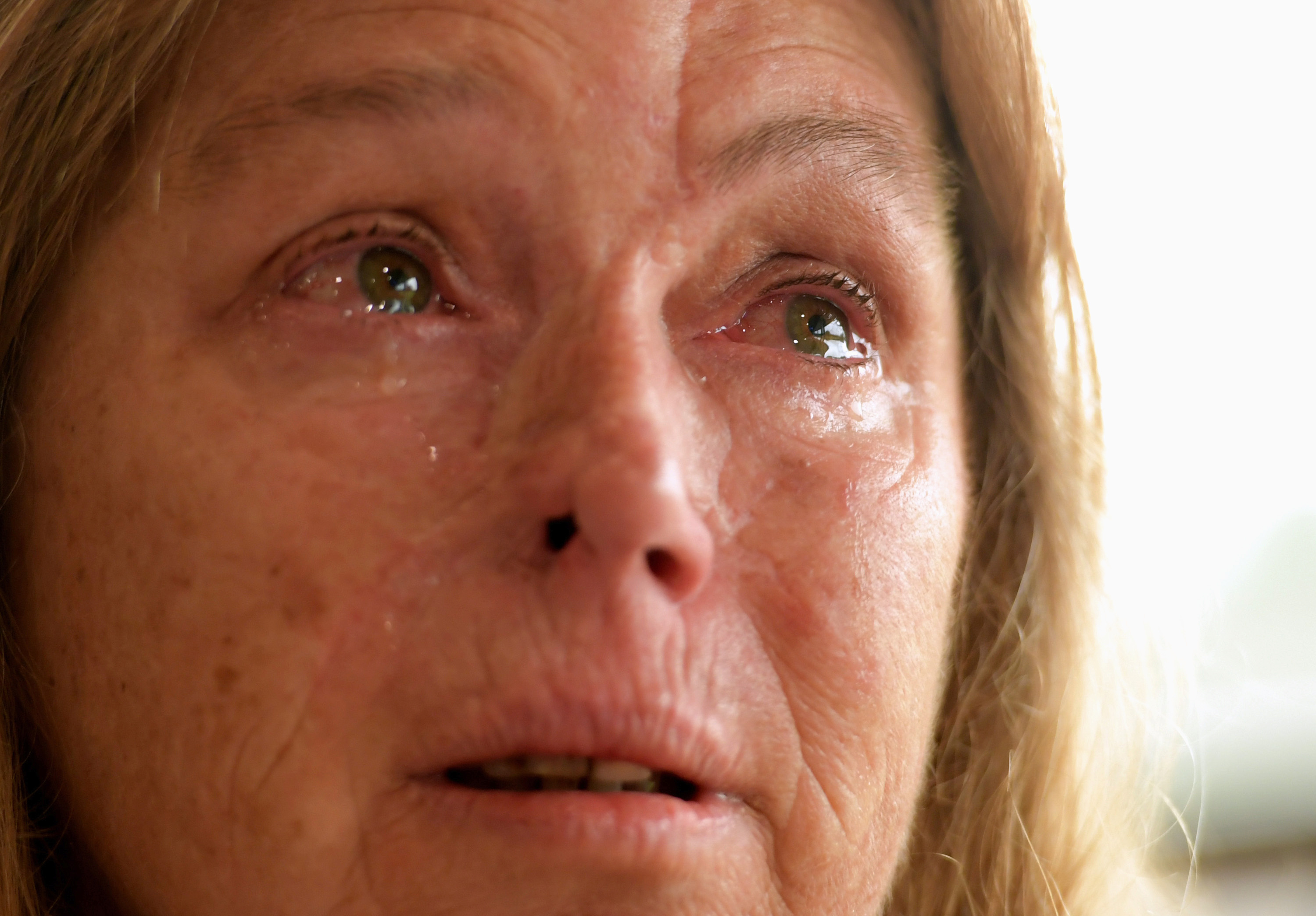 Sheryl Turner, who had trouble evacuating because she did not have fuel, becomes overwhelmed at the enormity of the bush fires last month at the evacuation center in Bomaderry, Australia. (CNS photo/Tracey Nearmy, Reuters) Sheryl Turner, who had trouble evacuating because she did not have fuel, becomes overwhelmed at the enormity of the bush fires last month at the evacuation center in Bomaderry, Australia. (CNS photo/Tracey Nearmy, Reuters)