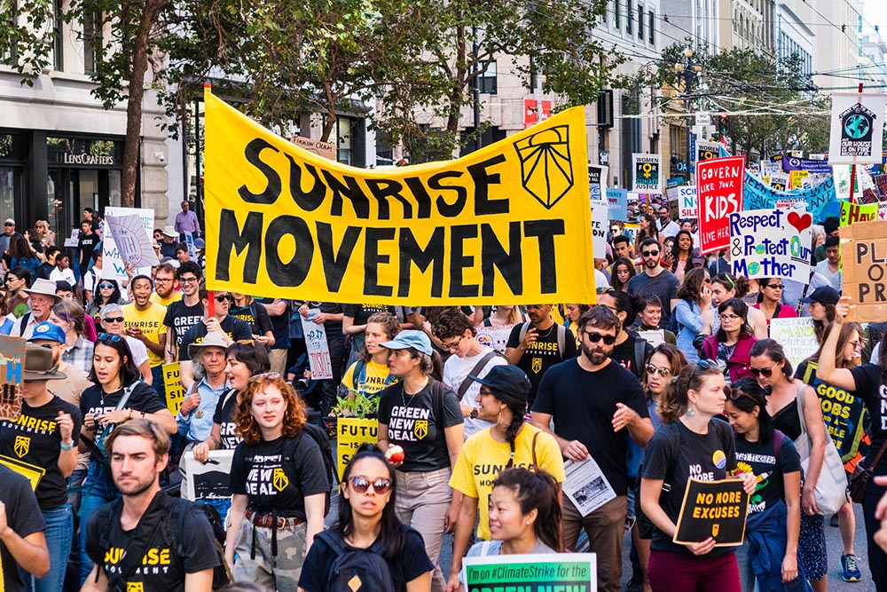 Members of the Sunrise Movement carry placards and banners at the Global Youth Climate Strike Rally and March in San Francisco Sept. 20, 2019. (Dreamstime/Andreistanescu) Members of the Sunrise Movement carry placards and banners at the Global Youth Climate Strike Rally and March in San Francisco Sept. 20, 2019. (Dreamstime/Andreistanescu)