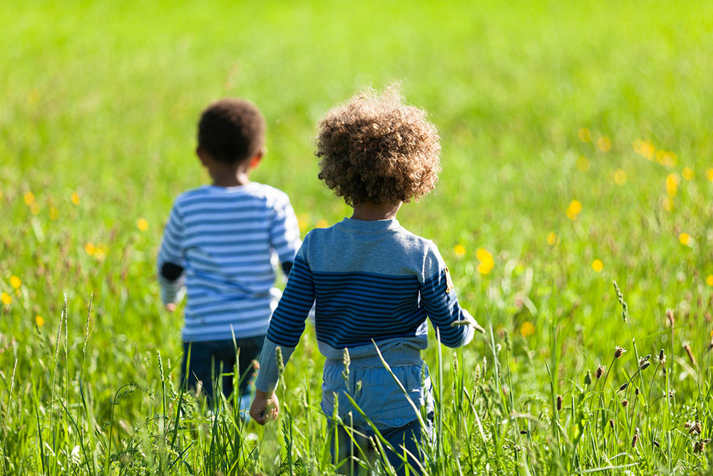 Black children play outdoors in this illustration photo. (Dreamstime/Sam74100)