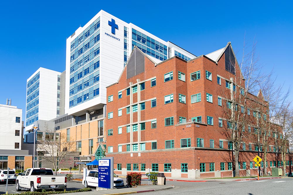 In Everett, Washington, a Providence sign is seen atop a medical center that is part of the Providence hospital system based in Renton, Washington. (Dreamstime/Clovercity)