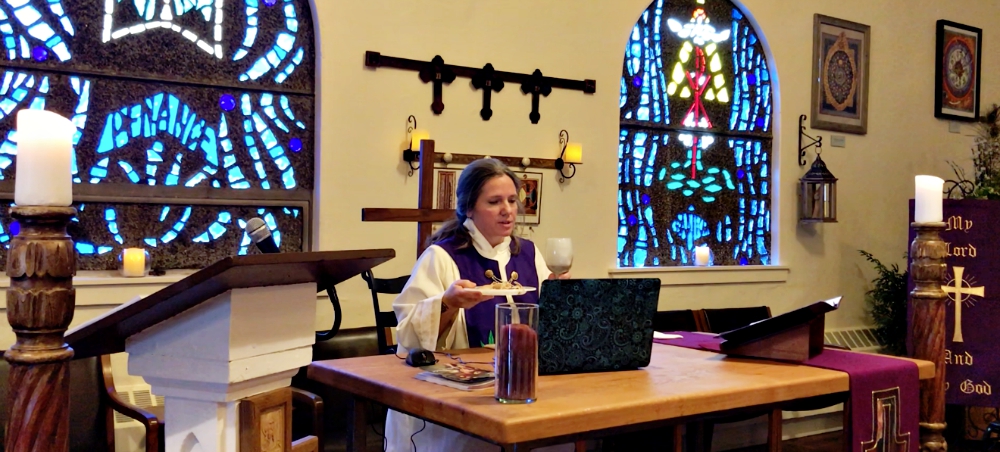 Shanon Sterringer celebrates the Eucharist at Hildegard Haus in Fairport Harbor, Ohio. (Rick Sterringer)