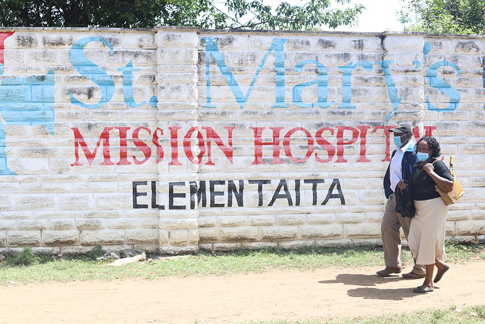 Patients seeking medical care walk towards the main entrance of St Mary's Mission Hospital Elementaita in Gilgil, in southwestern Kenya. This is a branch hospital of St. Mary’s Mission Hospital in Lang’ata, Nairobi. Patients of the hospitals say they are 