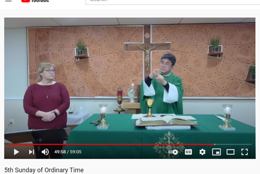 Fr. Min Seo Park signs the Mass in American Sign Language during a livestream Feb 6. Over 800 viewers watched via the Archdiocese of Washington Special Needs Ministry YouTube channel. (Screenshot by Joe Portolano/YouTube) Fr. Min Seo Park signs the Mass in American Sign Language during a livestream Feb 6. Over 800 viewers watched via the Archdiocese of Washington Special Needs Ministry YouTube channel. (Screenshot by Joe Portolano/YouTube)