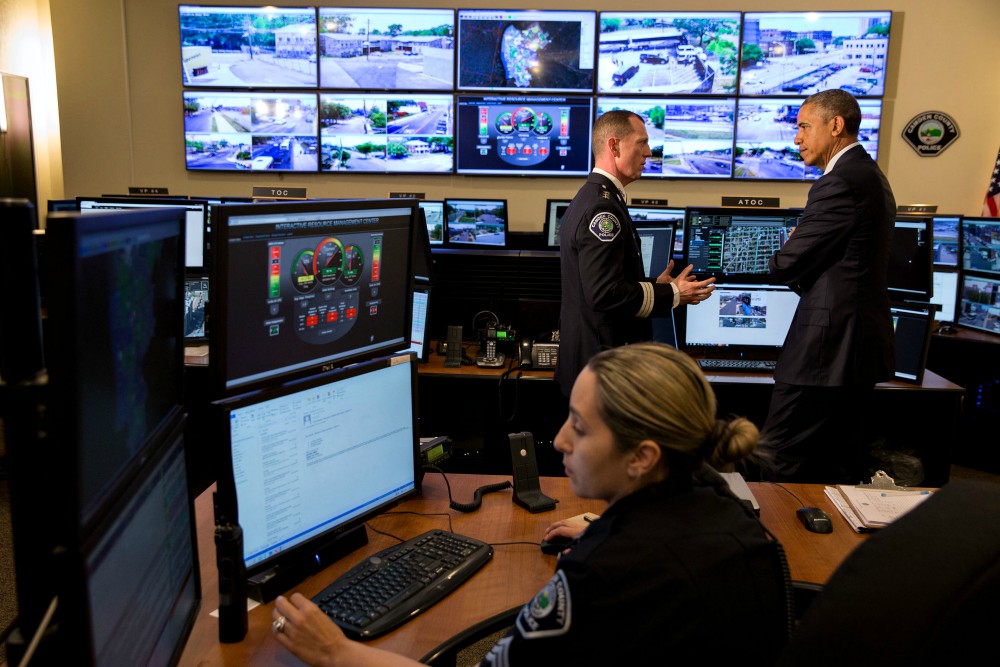 President Barack Obama, with Camden County Metro Police Chief John Scott Thomson, takes a tour of the Real Time Tactical Operational Intelligence Center at Camden County Police Headquarters in Camden, New Jersey, May 18, 2015. (Obama White House Archives)