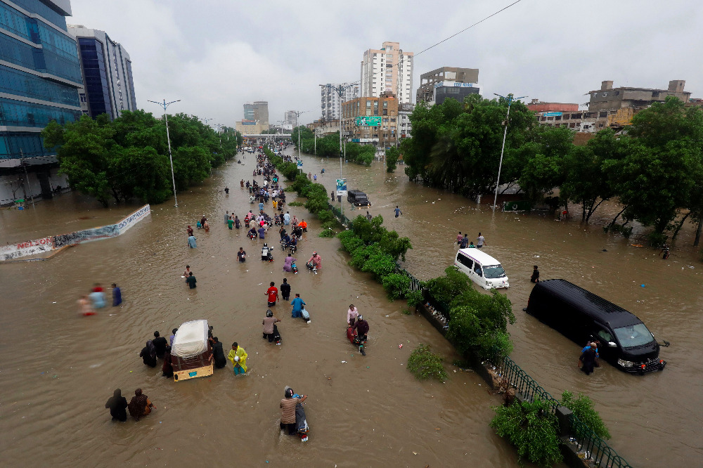 Climate change increases the likelihood of extreme weather, like the rains that caused this flooding in Karachi, Pakistan, in late August 2020. (CNS photo/Akhtar Soomro, Reuters)