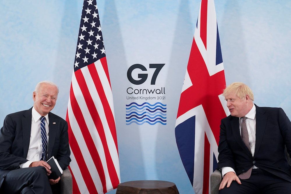 U.S. President Joe Biden laughs while speaking with British Prime Minister Boris Johnson on June 10 ahead of the Group of Seven summit. (CNS/Reuters/Kevin Lamarque)