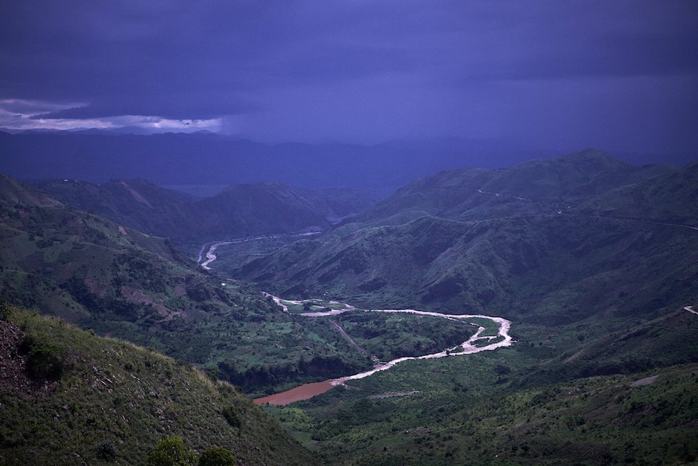 Mountains and the country of Rwanda are seen across the Ruzizi River near Bukavu, Democratic Republic of Congo, in 2014. The Congolese bishops have sharpened their focus on protecting the Congo Basin. (CNS photo/Sam Phelps, CRS)