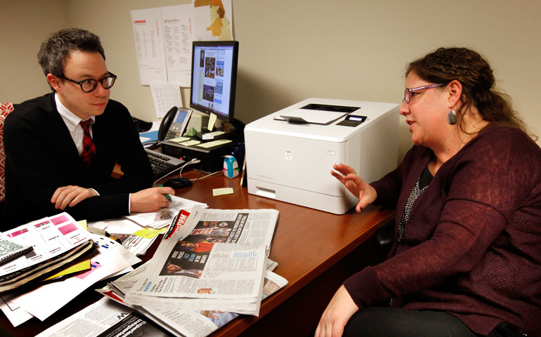 Grant Gallicho talks with Joyce Duriga, editor of the Catholic New World, in December. (Catholic New World/Karen Callaway)