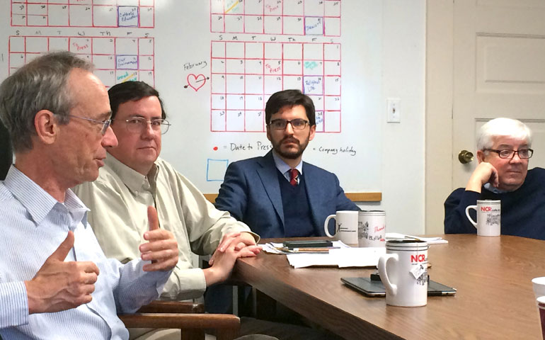 The NCR team based in Washington came to Kansas City, Mo., Jan. 15-16 for planning with headquarters staff. From left are Jesuit Fr. Tom Reese, Dennis Coday, Joshua McElwee and Tom Roberts. (NCR photos/Thomas C. Fox)