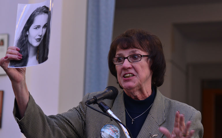 Vicki Schieber, holding a portrait of her daughter, Shannon, discusses her opposition to the death penalty during a Nov. 9 conference hosted by The Catholic University of America and the Columbus School of Law. (Newscom/ZUMA Press/Miguel Juarez Lugo)