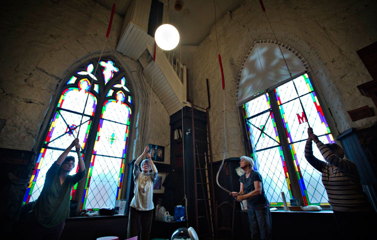 Parishioners ring the 100-year-old bells in the tower of Holy Rosary Cathedral in honor of new Pope Francis in Vancouver, British Columbia, March 13, 2013. (Reuters/Andy Clark)