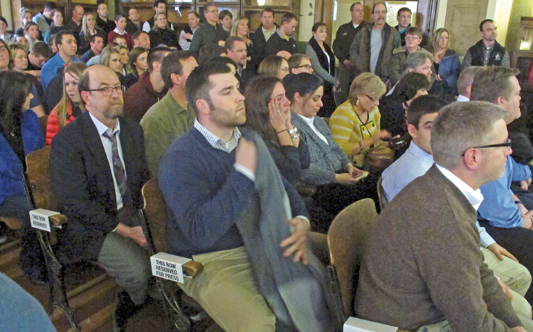 A packed spectator section for the trial of former University of Montana quarterback Jordan Johnson looks on after Johnson was acquitted of rape charges March 1, 2013, in Missoula, Mont. (AP Photo/Matt Gouras)