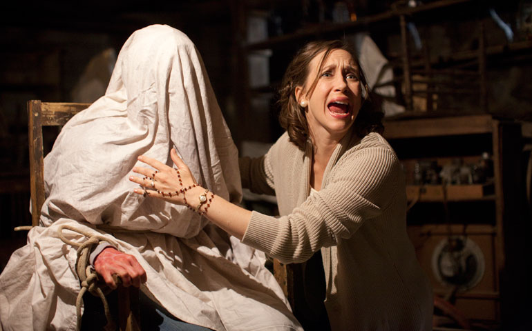 Vera Farmiga, right, stars as Lorraine Warren in "The Conjuring." (©Warner Bros.)