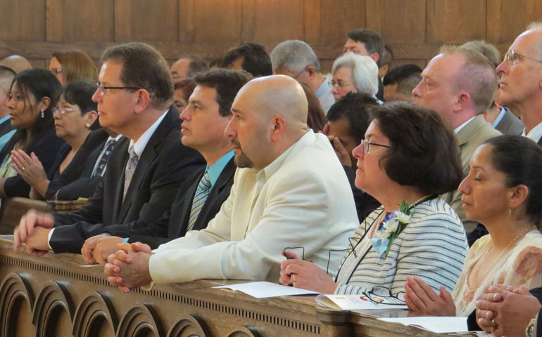 Lay ecclesial ministers kneel during the Mass to celebrate their certification at the Cathedral at the Madeleine in Salt Lake City Aug. 9. (Intermountain Catholic)