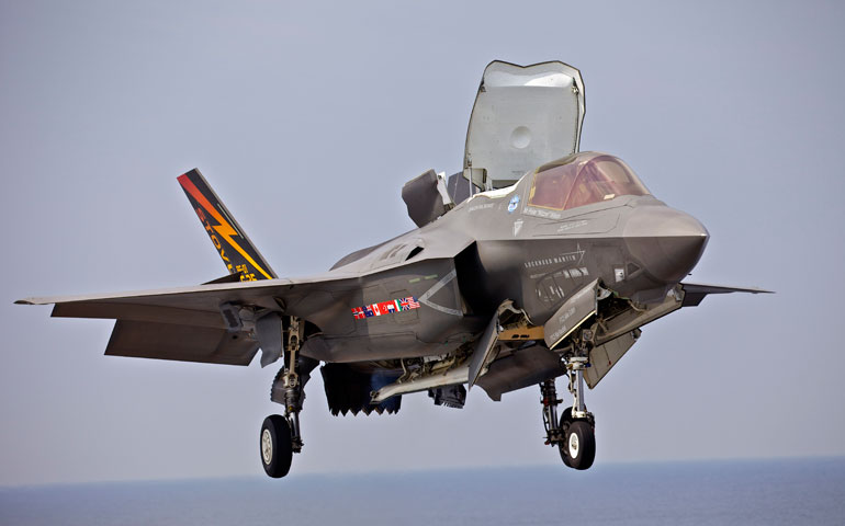 An F-35 Lightning II aircraft hovers prior to landing on the flight deck of the amphibious assault ship USS Wasp in August 2013. (Newscom/Polaris)