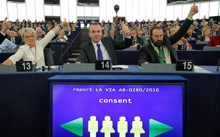 Members of the European Parliament vote in favor of the Paris U.N. COP21 climate change agreement Oct. 4 at a plenary meeting in Strasbourg, France. (CNS/Reuters/Vincent Kessler)