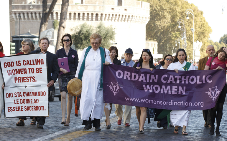 Maryknoll Fr. Roy Bourgeois marches down Via della Conciliazione toward the Vatican during a demonstration Oct. 17, 2011, in Rome. (CNS/Paul Haring)