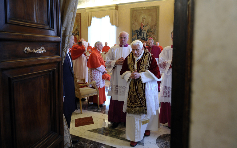 Pope Benedict XVI leaves after announcing his resignation in Latin during a Feb. 11, 2013, meeting of cardinals at the Vatican. (CNS/L'Osservatore Romano)
