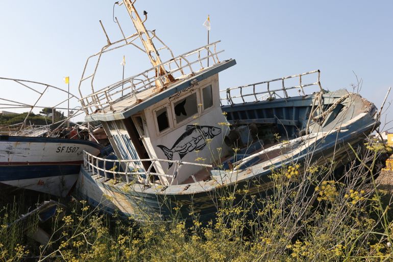 Boats that made voyages from Africa lie abandoned at the port in Lampedusa, Italy, July 7. (photo/CNS)