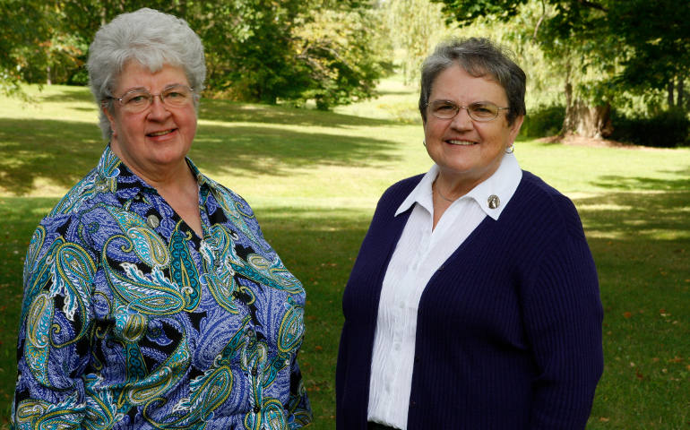 Humilty of Mary Srs. Mary Cunningham and Barbara O'Donnell are shown on the grounds of the order's motherhouse in Villa Maria, Pa., in September. The sisters played leading roles in their order's months-long discernment that led to a decision to turn down multiple offers to lease part of the grounds for natural gas development using fracking. (CNS photo/Dennis Sadowski)
