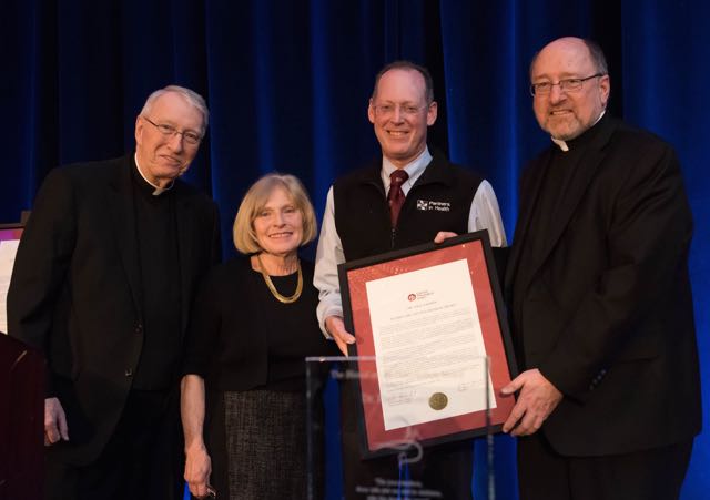 Rev. Kurt F. Hartrich, O.F.M., chair of the CTU Board of Trustees; Carole Segal, CTU supporter and award presenter; Dr. Paul Farmer; Rev. Mark R. Francis, C.S.V., president of CTU (Photos by Mark Campbell)