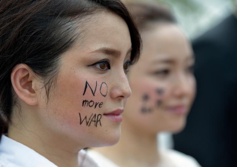 Women participate in a memorial ceremony in Nagasaki, Japan, Aug. 9, the 70th anniversary of the day the United States dropped an atomic bomb on the city. (CNS/Paul Jeffrey)